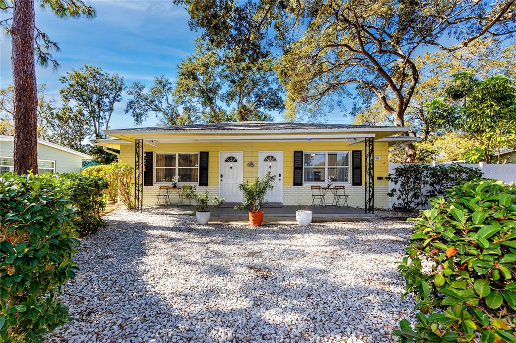 5596 100th Way North St. Petersburg, FL 33708 - Photo 1 of 67 a view of a house with backyard sitting area and garden