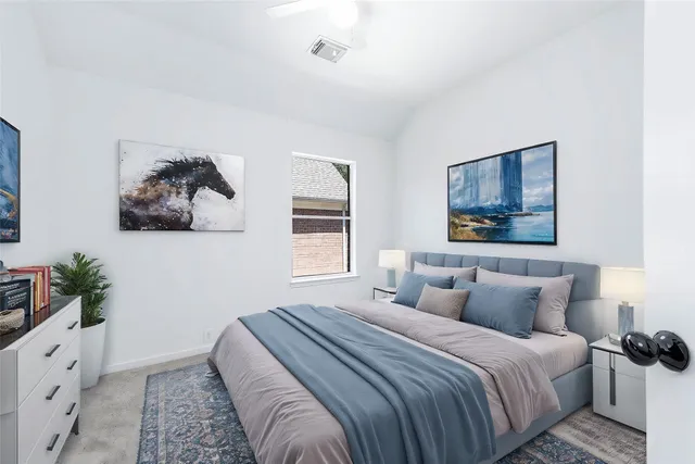 a bedroom with a bed and a potted plant
