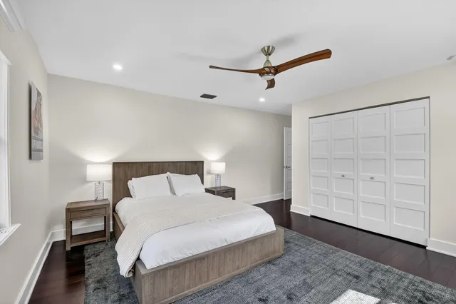 a bedroom with a bed and a cabinets