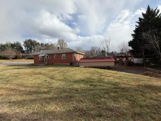 a view of house with yard and entertaining space