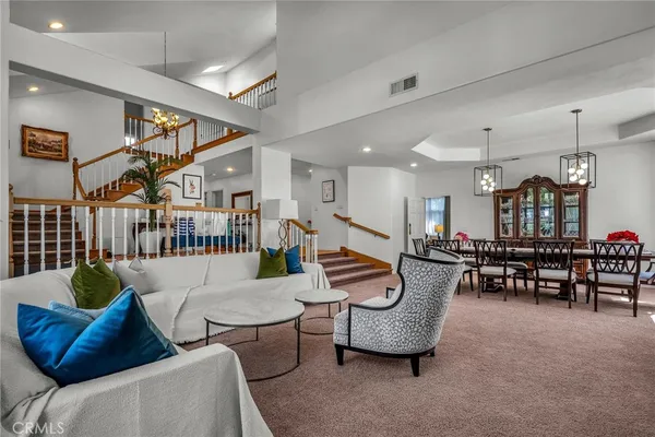 a living room with furniture and a rug