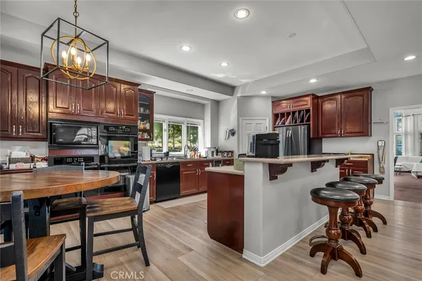 a kitchen with lots of counter top space and appliances