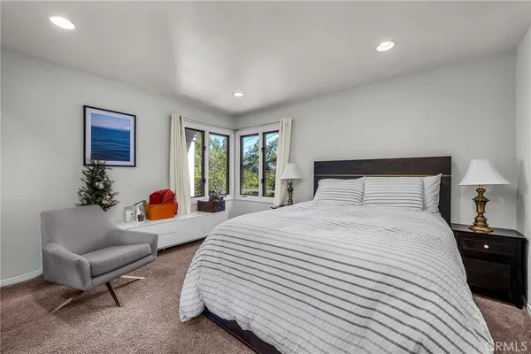 a bedroom with a bed and a couch