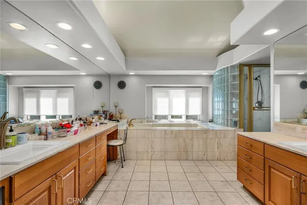 a large kitchen with lots of counter space and sink