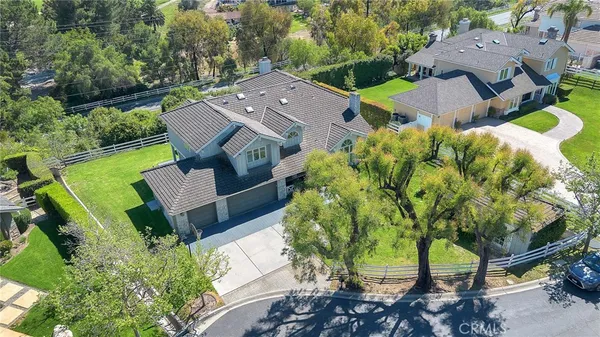 an aerial view of a house with a garden