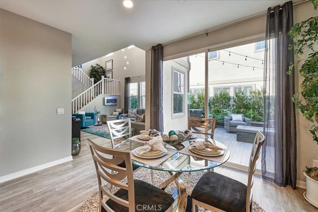 944 Sunlit Lane Costa Mesa, CA 92626 - Photo 14 of 71 a dining room with furniture window and wooden floor