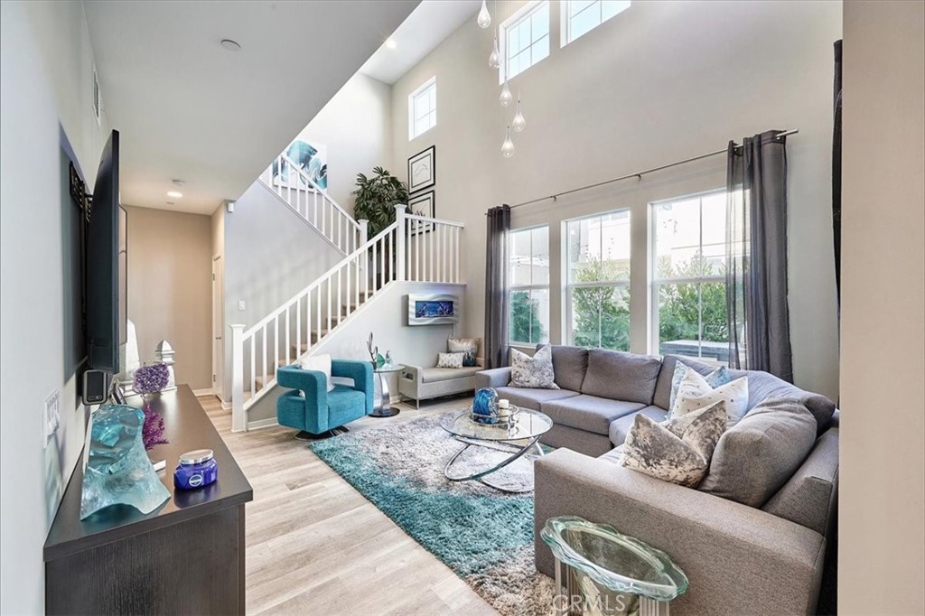 944 Sunlit Lane Costa Mesa, CA 92626 - Photo 15 of 71 a living room with furniture and a large window