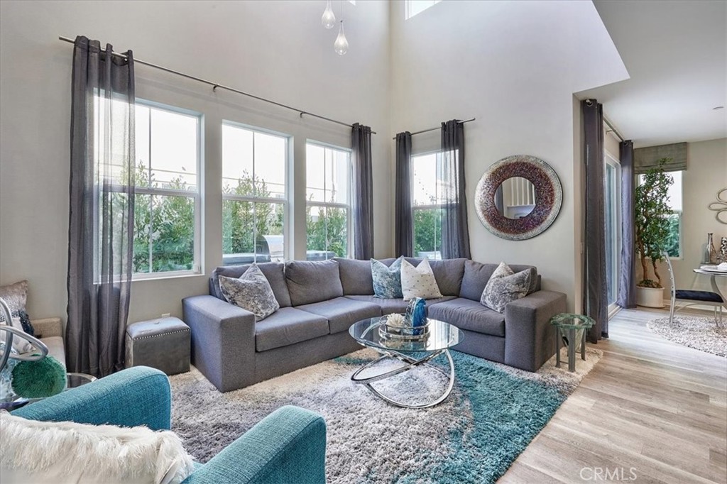 944 Sunlit Lane Costa Mesa, CA 92626 - Photo 16 of 71 a living room with furniture and a large window