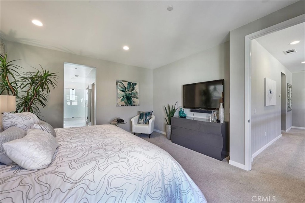 944 Sunlit Lane Costa Mesa, CA 92626 - Photo 31 of 71 a bedroom with a bed and a flat screen tv