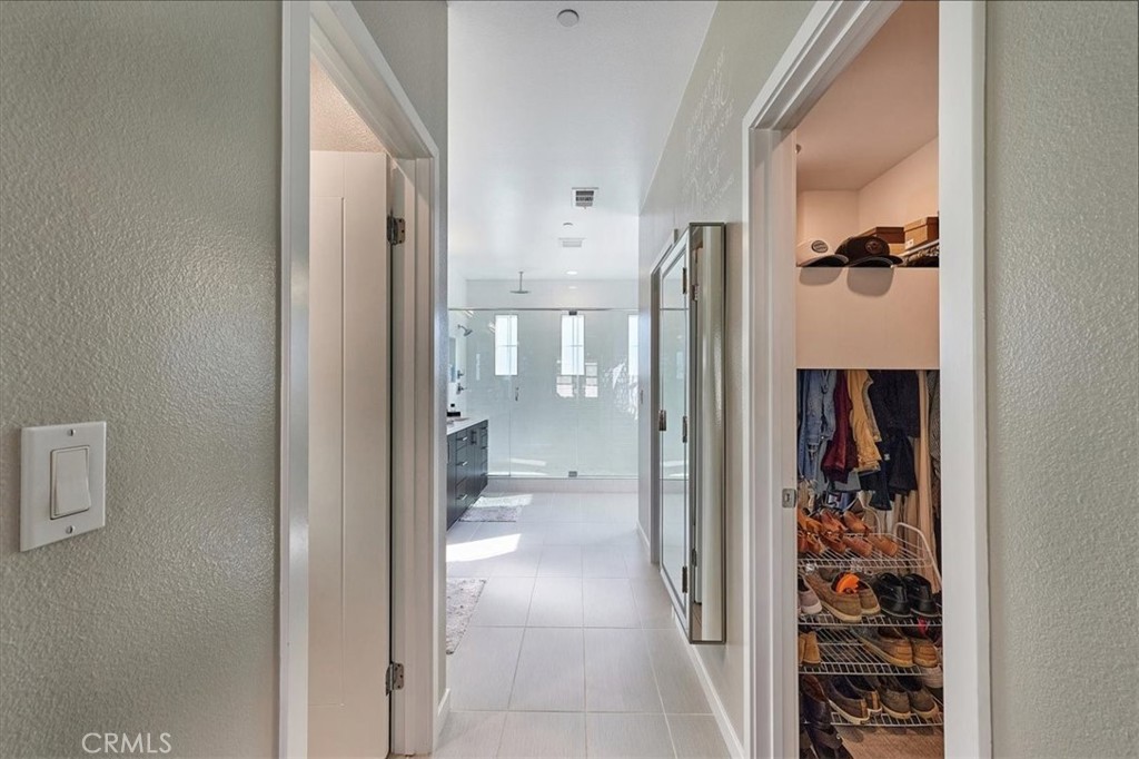 944 Sunlit Lane Costa Mesa, CA 92626 - Photo 33 of 71 a bathroom with a glass shower door and a toilet