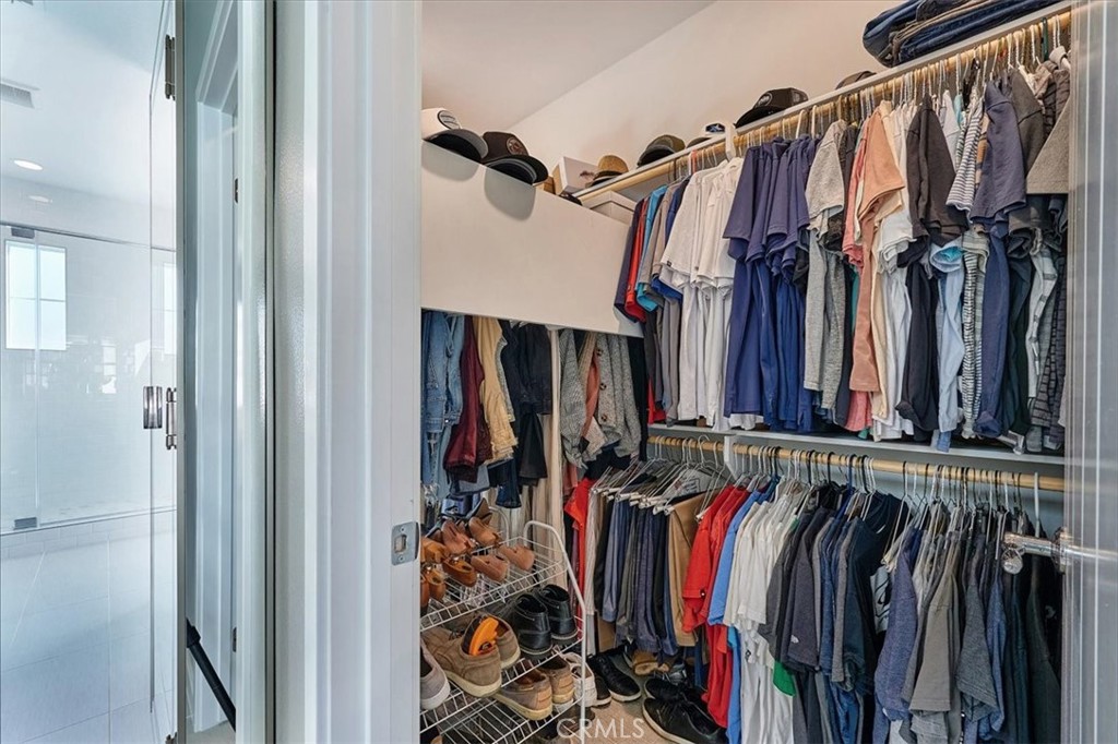 944 Sunlit Lane Costa Mesa, CA 92626 - Photo 34 of 71 a view of walk in closet with clothes