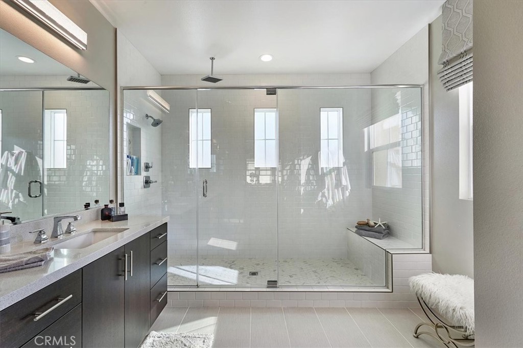 944 Sunlit Lane Costa Mesa, CA 92626 - Photo 39 of 71 a bathroom with a bathtub shower sink and toilet