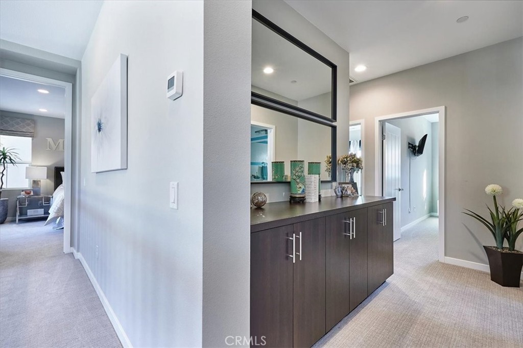 944 Sunlit Lane Costa Mesa, CA 92626 - Photo 41 of 71 a kitchen with stainless steel appliances granite countertop a refrigerator and a sink