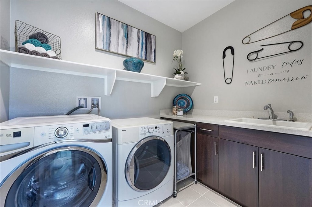 944 Sunlit Lane Costa Mesa, CA 92626 - Photo 53 of 71 a utility room with dryer and washer