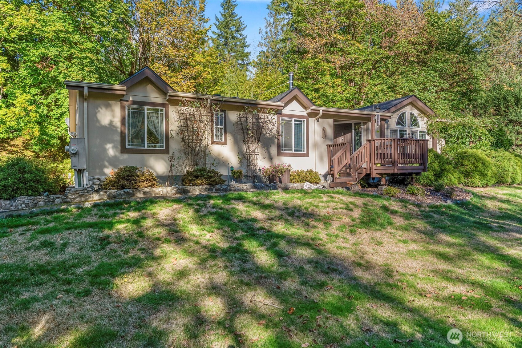 a front view of a house with a garden