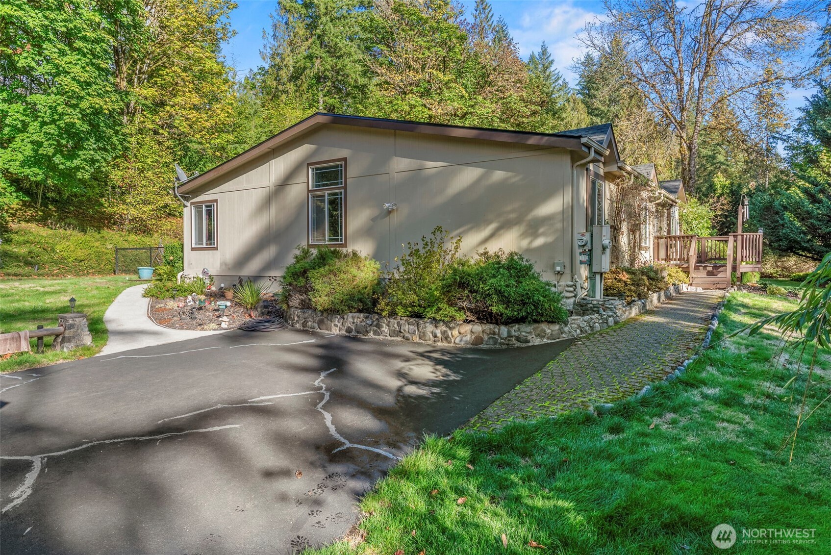 5416 Rose Valley Road Kelso, WA 98626 - Photo 2 of 28 a backyard of a house with a garden and plants