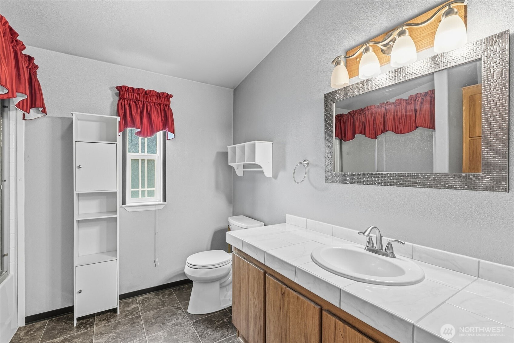 5416 Rose Valley Road Kelso, WA 98626 - Photo 23 of 28 a bathroom with a granite countertop sink and a mirror