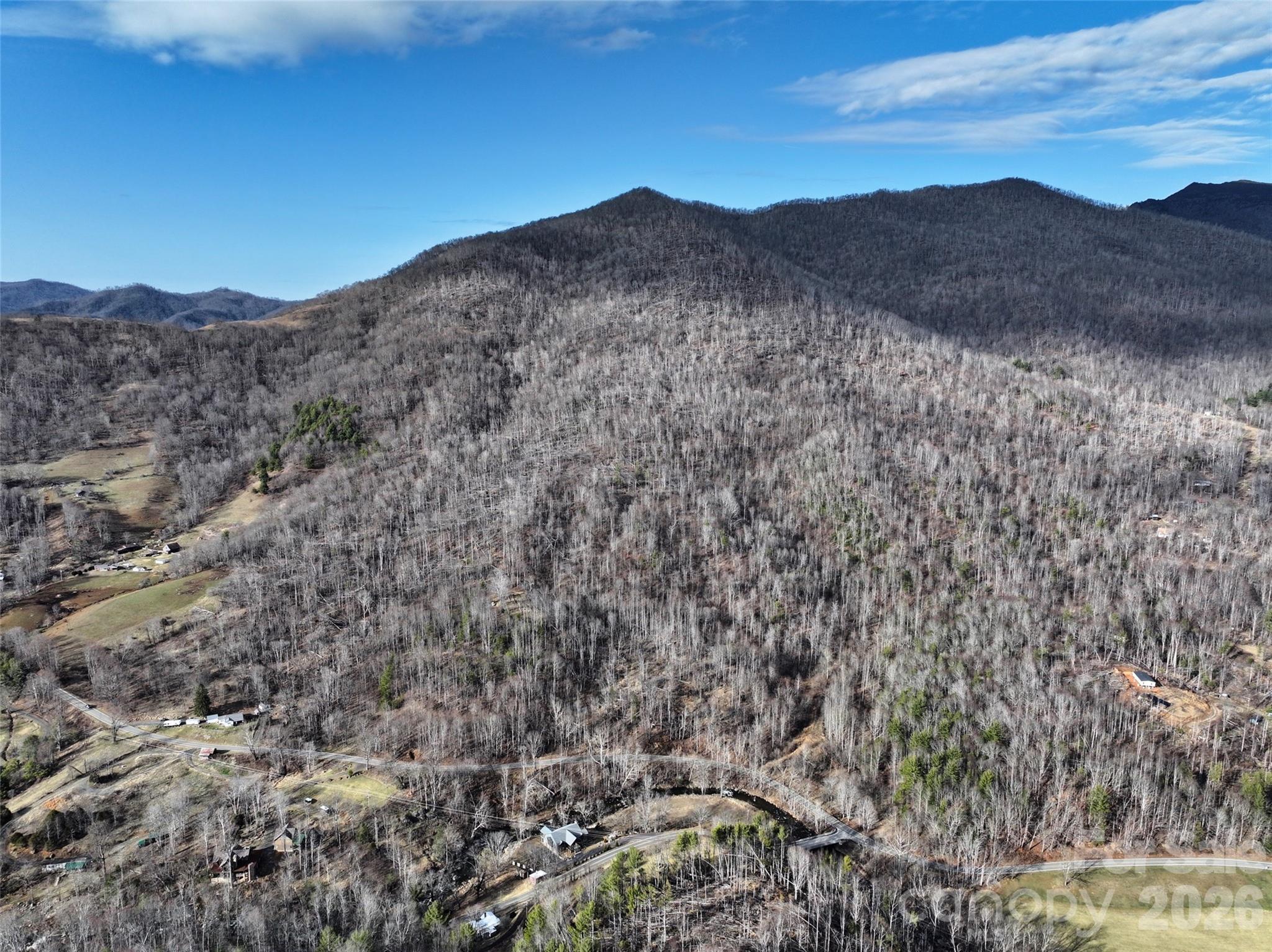 0 Fork Mountain Road Bakersville, NC 28705 - Photo 1 of 45 a view of a dry yard with mountains in the background