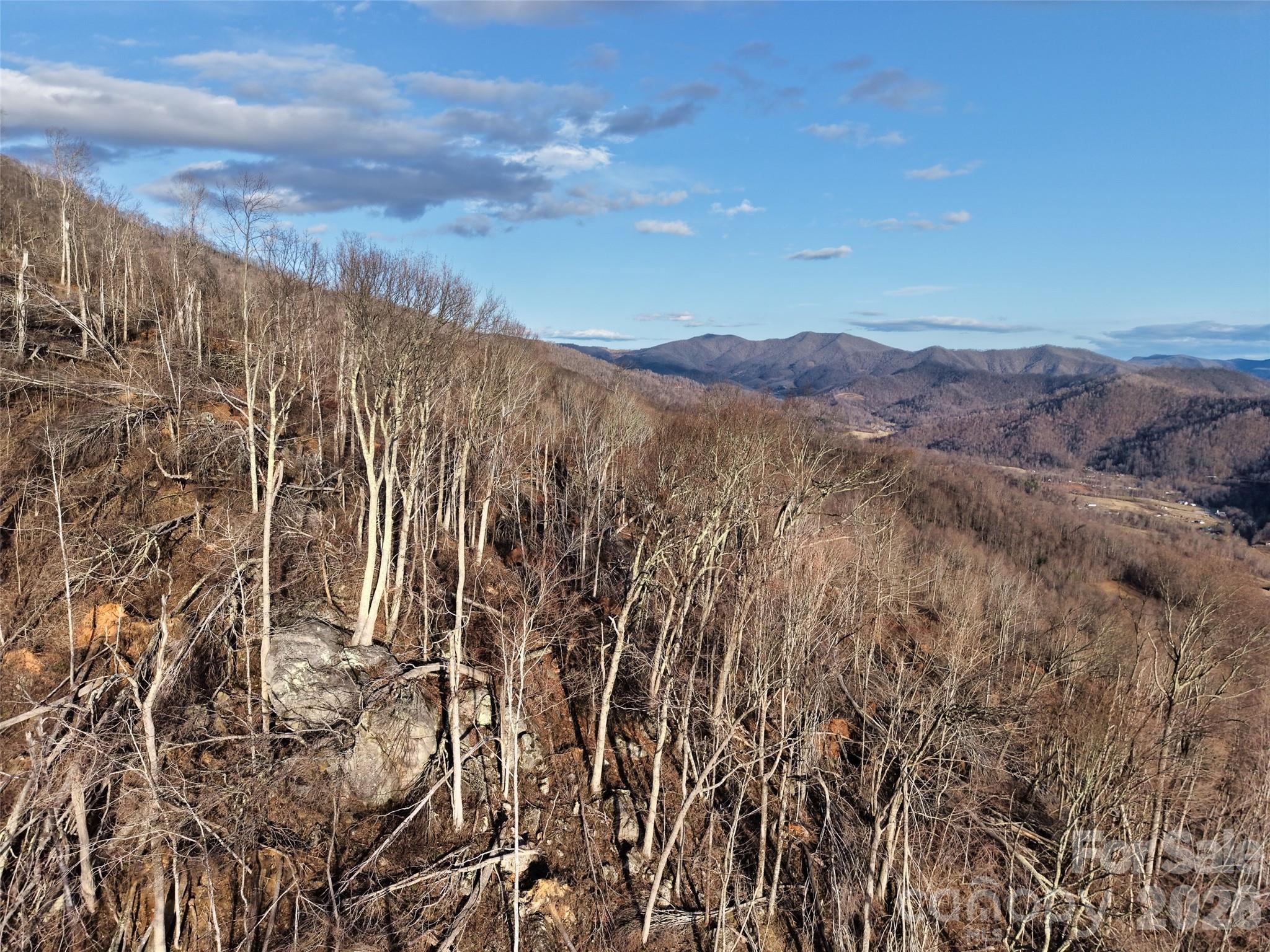 0 Fork Mountain Road Bakersville, NC 28705 - Photo 35 of 45 a view of a building with mountains in the background