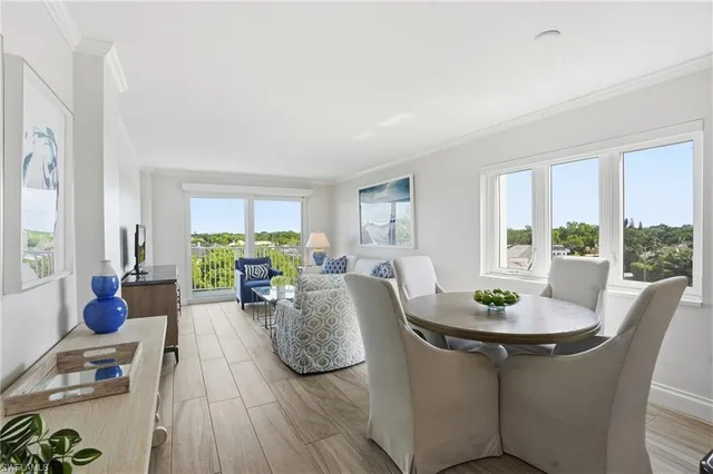 a view of a dining room with furniture window and outside view