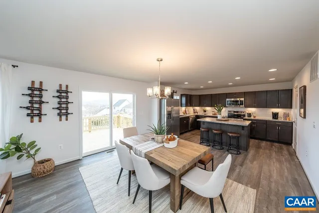 a open kitchen with a table and chairs in it