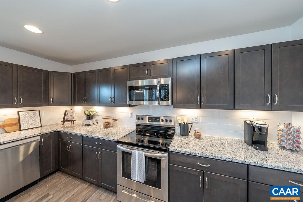 86 Lookover Terrace Stuarts Draft, VA 24477 - Photo 16 of 31 a kitchen with stainless steel appliances granite countertop a sink stove and cabinets