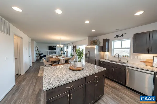 a kitchen with lots of counter top space and living room