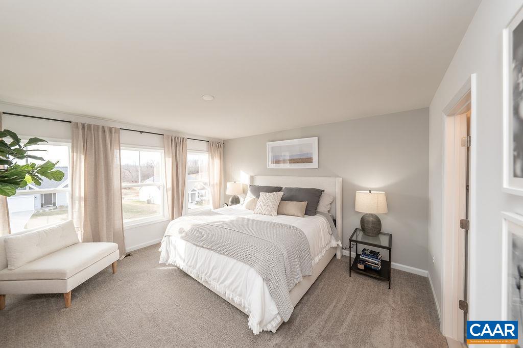 86 Lookover Terrace Stuarts Draft, VA 24477 - Photo 19 of 31 a bedroom with a bed and a couch next to a window