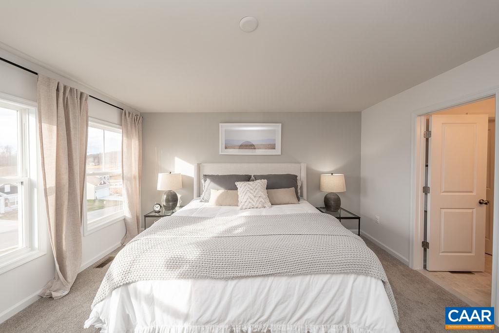 86 Lookover Terrace Stuarts Draft, VA 24477 - Photo 21 of 31 a bedroom with a bed and a large window