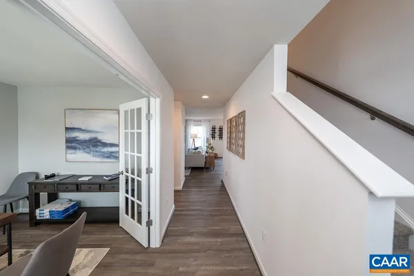 a view of a hallway view with living room with furniture and a window