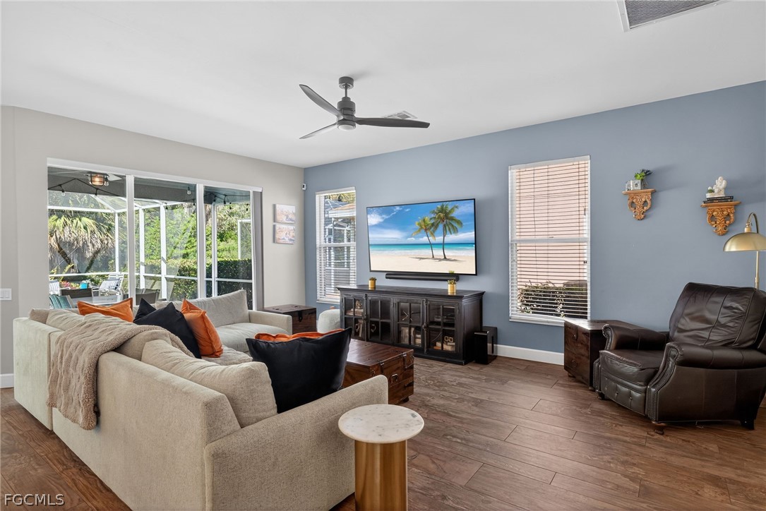 22866 Forest Ridge Drive Estero, FL 33928 - Photo 10 of 38 a living room with furniture and a flat screen tv