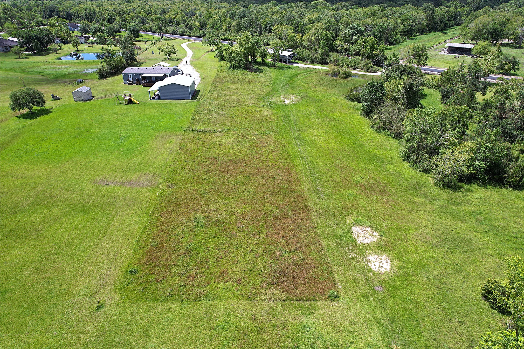 6607 Highland Road Santa Fe, TX 77517 - Photo 7 of 11 a view of yard with swimming pool