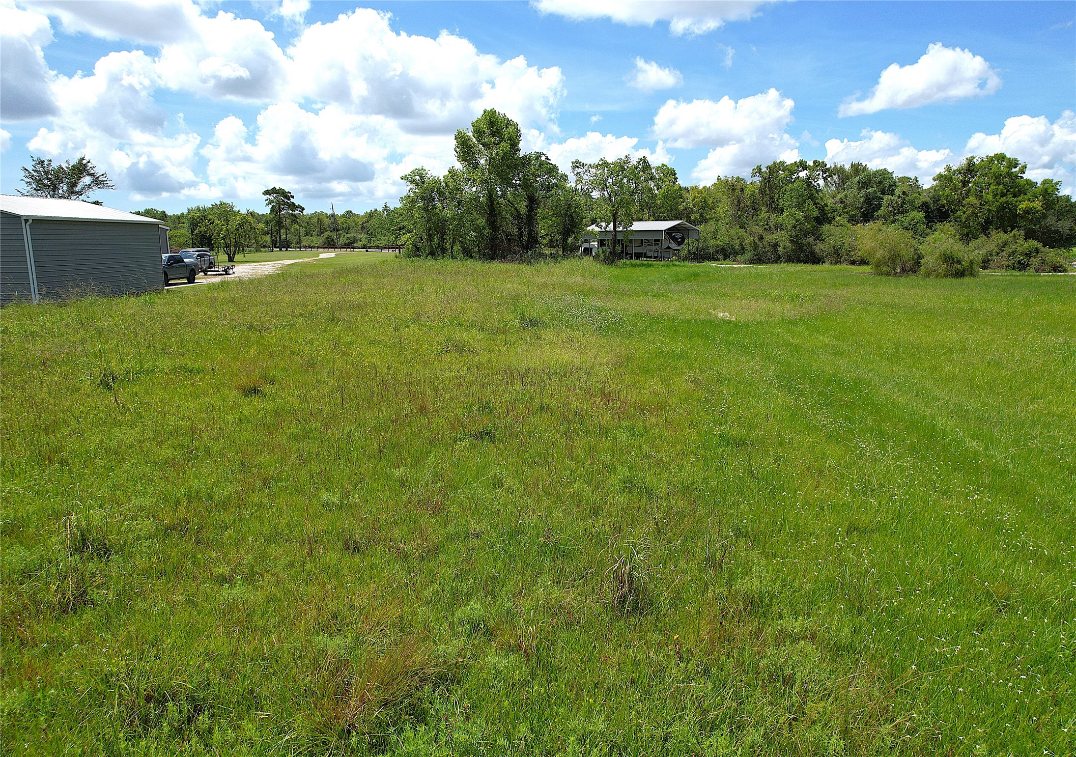 6607 Highland Road Santa Fe, TX 77517 - Photo 8 of 11 a view of an outdoor space and a yard