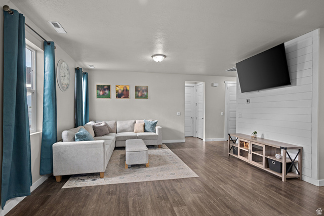 1074 South 750 West Springville, UT 84663 - Photo 5 of 28 Spacious interior featuring wood-finish flooring, light grey wall paint, and a shiplap accent wall