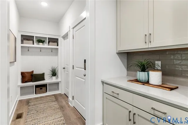 a living room with furniture and flat screen tv
