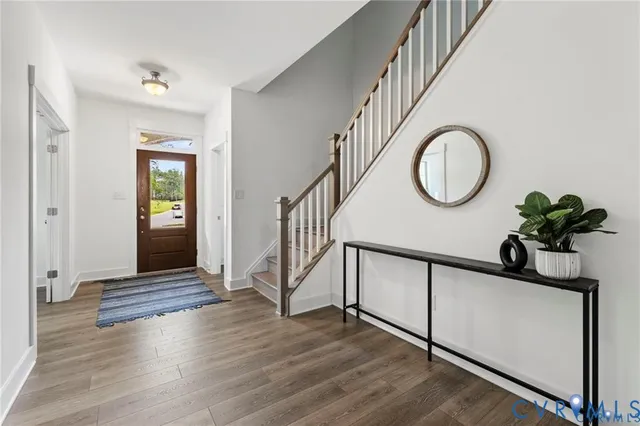 a view of entryway with wooden floor