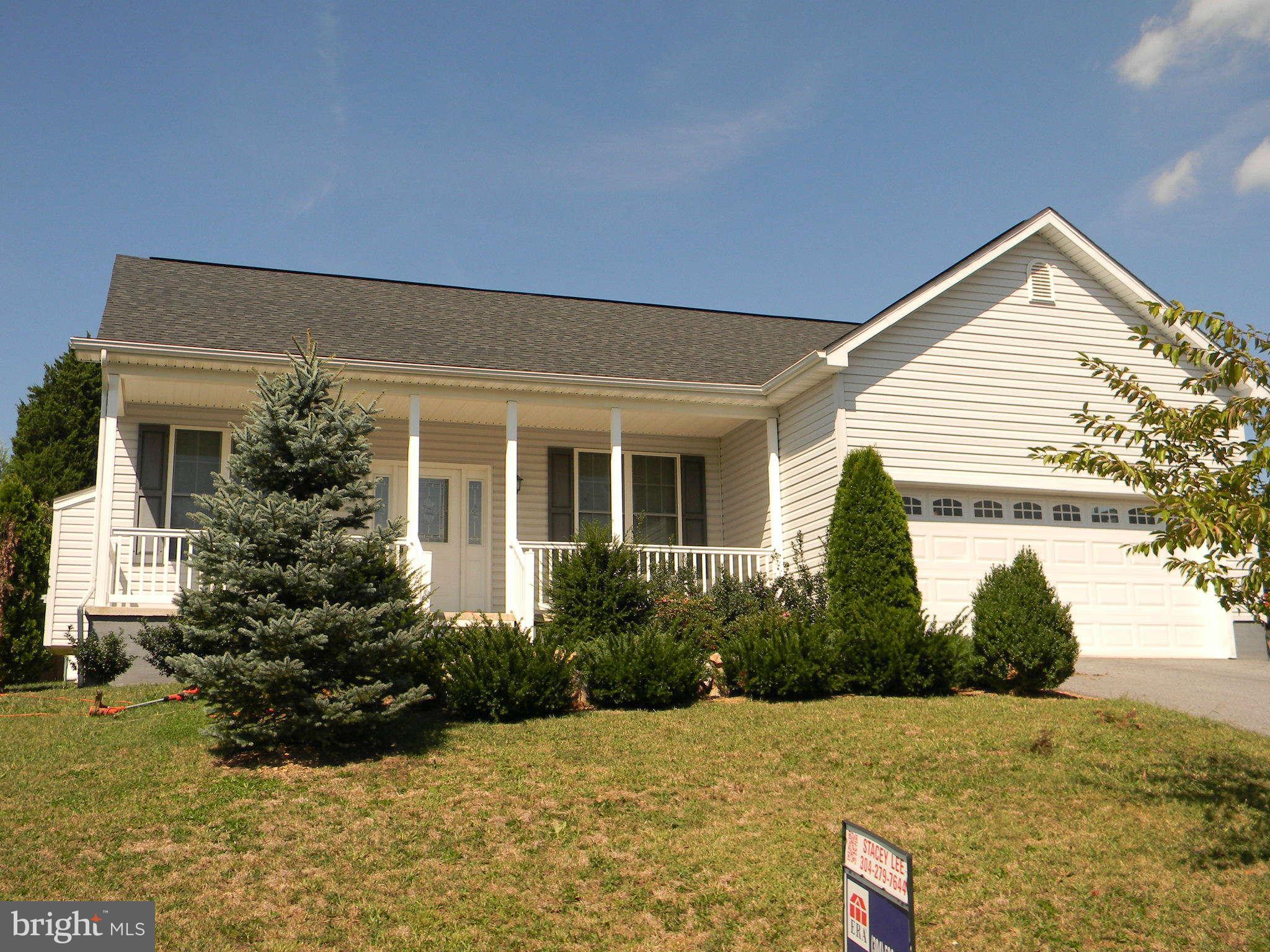 115 Lair Way Inwood, WV 25428 - Photo 2 of 28 front view of house with potted plants