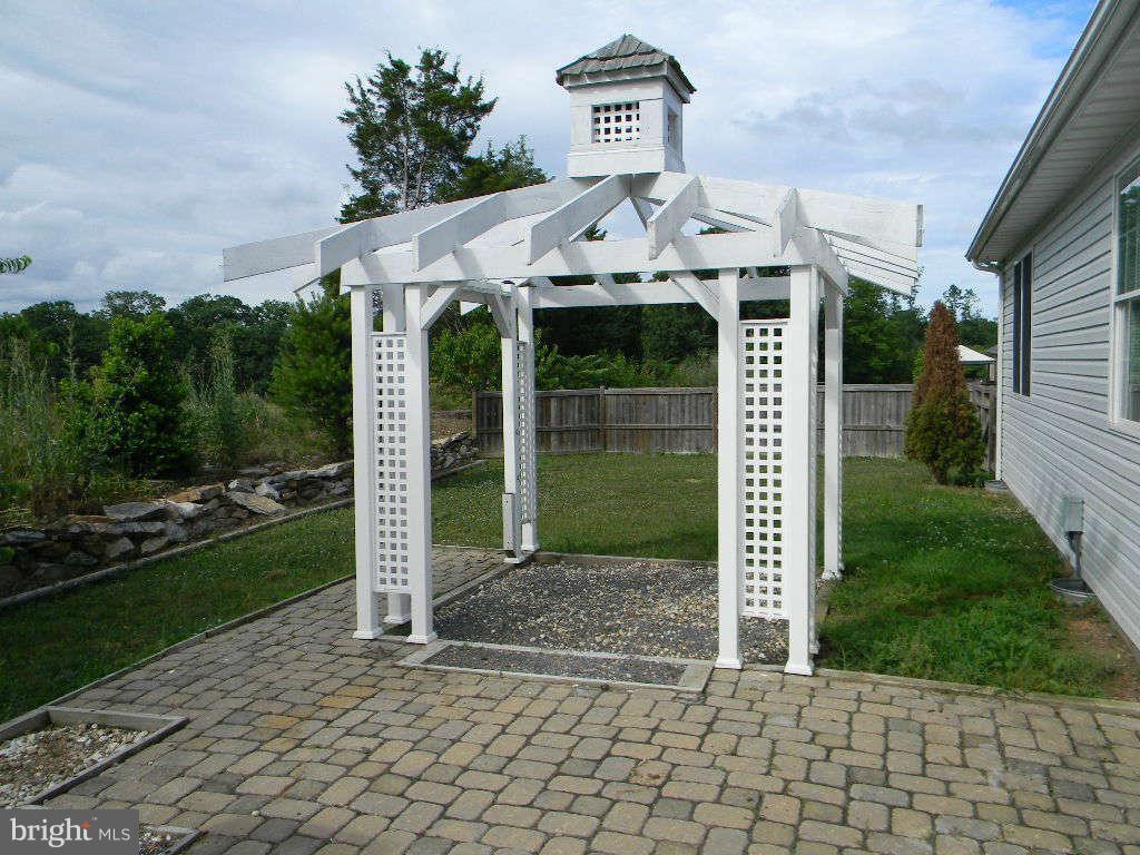 115 Lair Way Inwood, WV 25428 - Photo 6 of 28 a front view of a house with garden