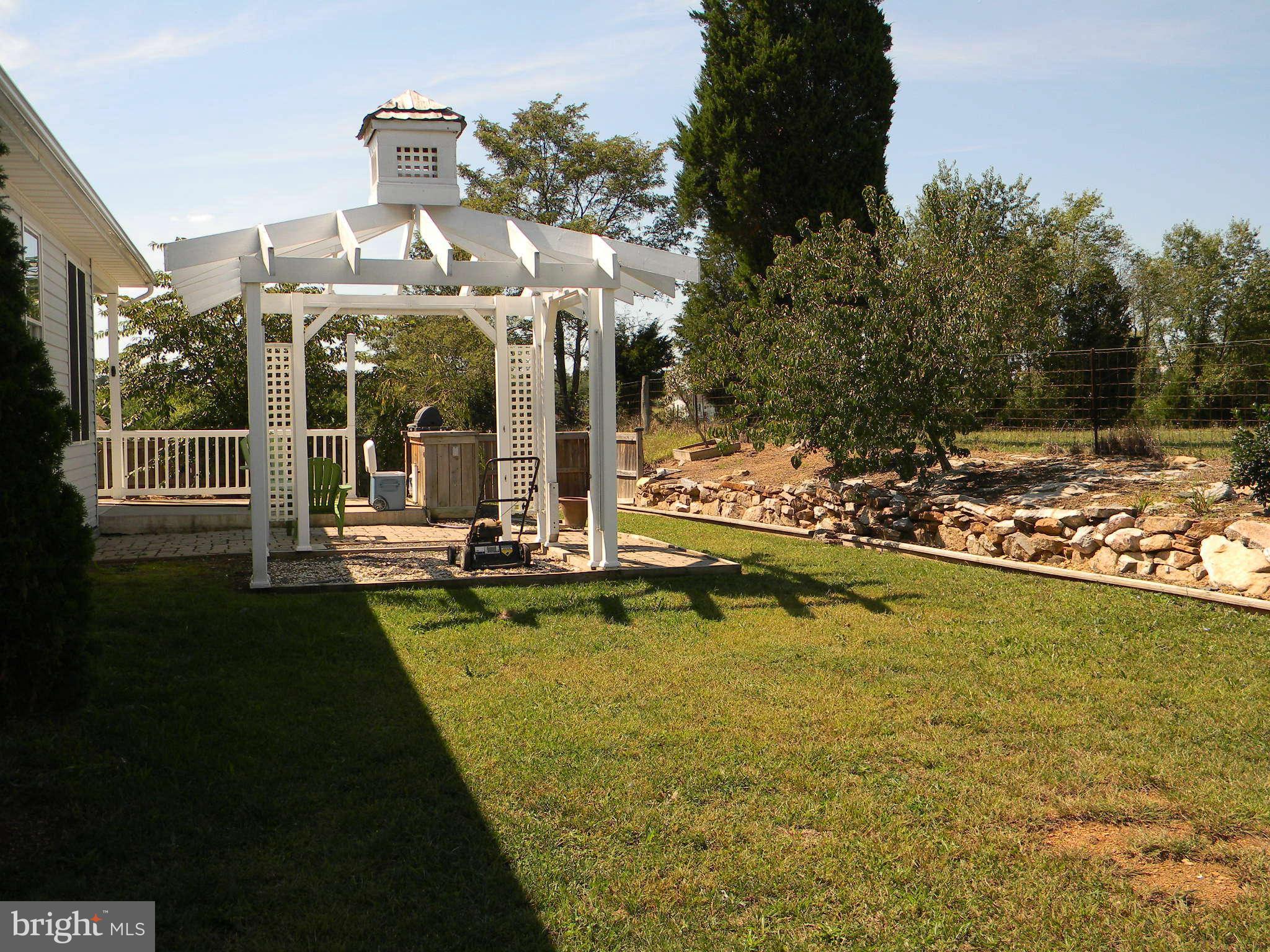 115 Lair Way Inwood, WV 25428 - Photo 8 of 28 a view of a swimming pool with outdoor seating