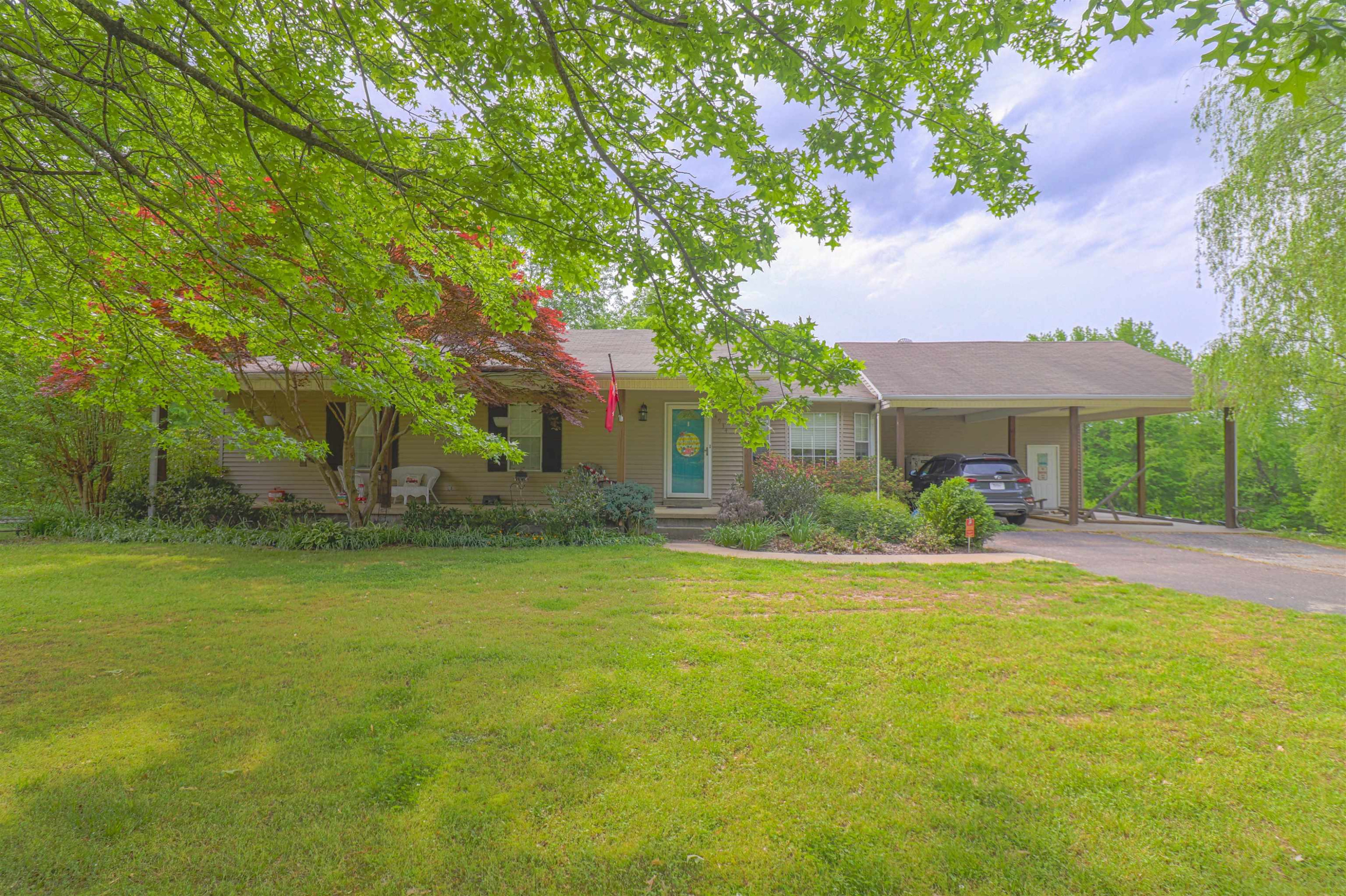 4934 Asbury Glimp Road Ripley, TN 38063 - Photo 1 of 25 a front view of a house with a yard