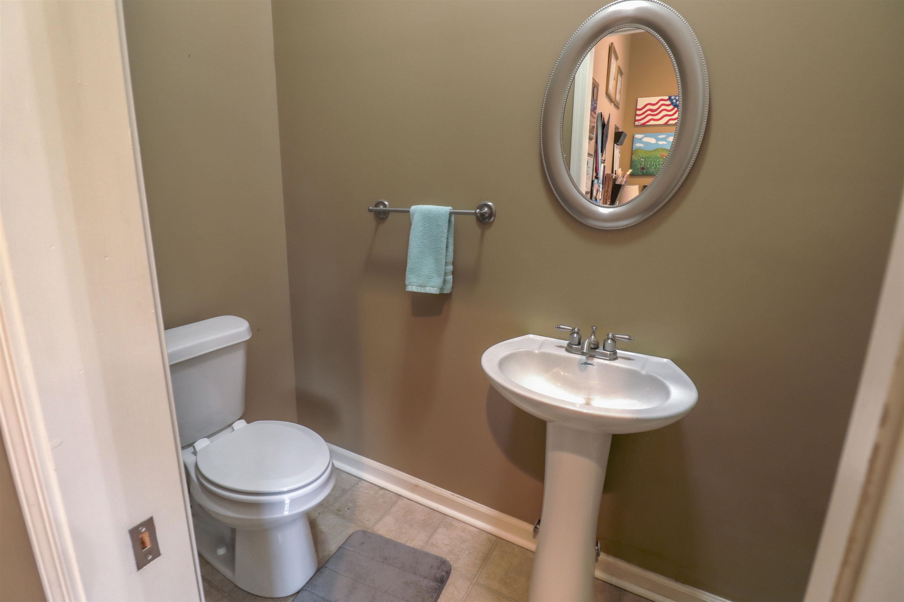 4934 Asbury Glimp Road Ripley, TN 38063 - Photo 18 of 25 a bathroom with a sink and a mirror
