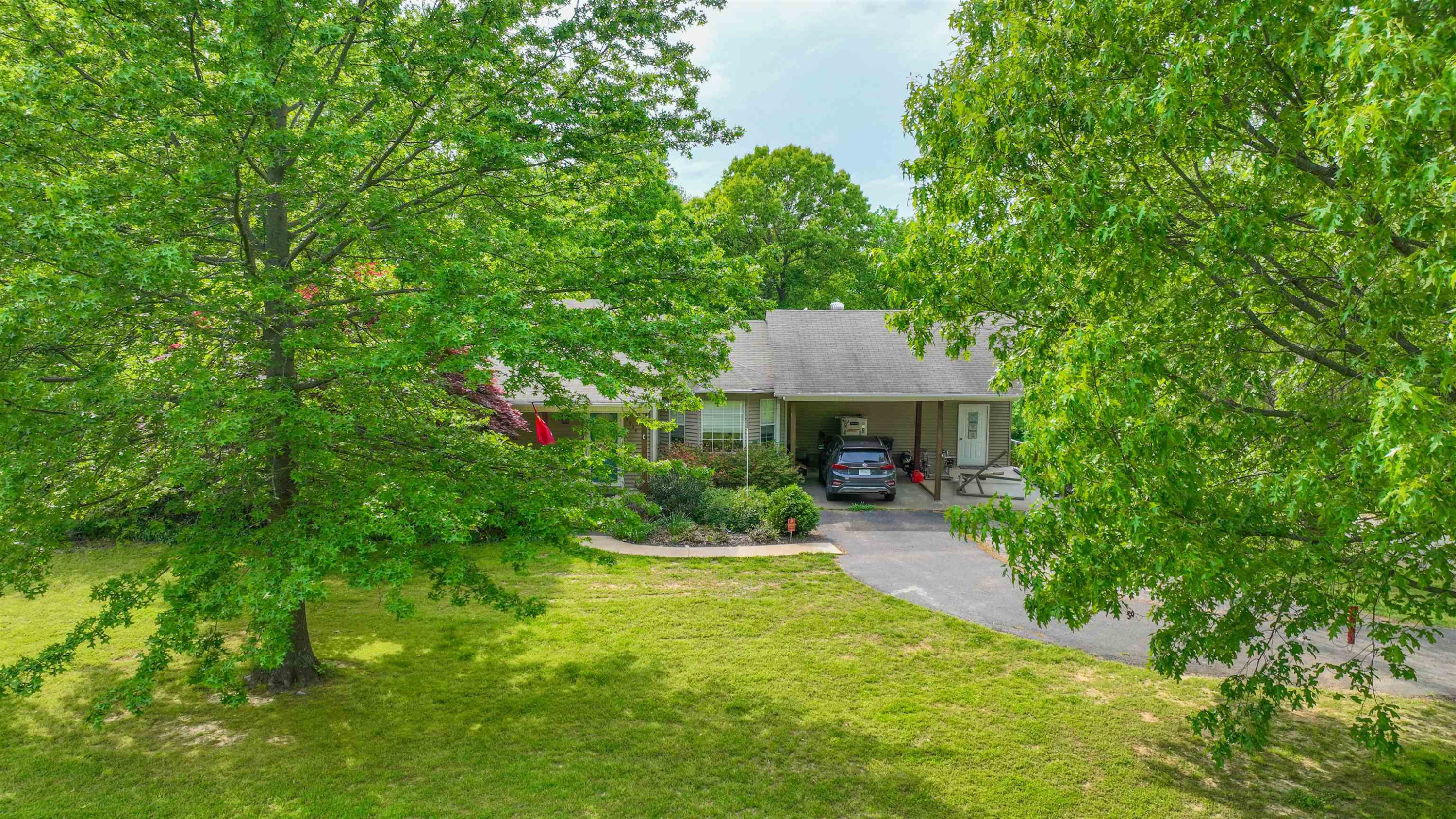 4934 Asbury Glimp Road Ripley, TN 38063 - Photo 24 of 25 a front view of a house with a yard and porch