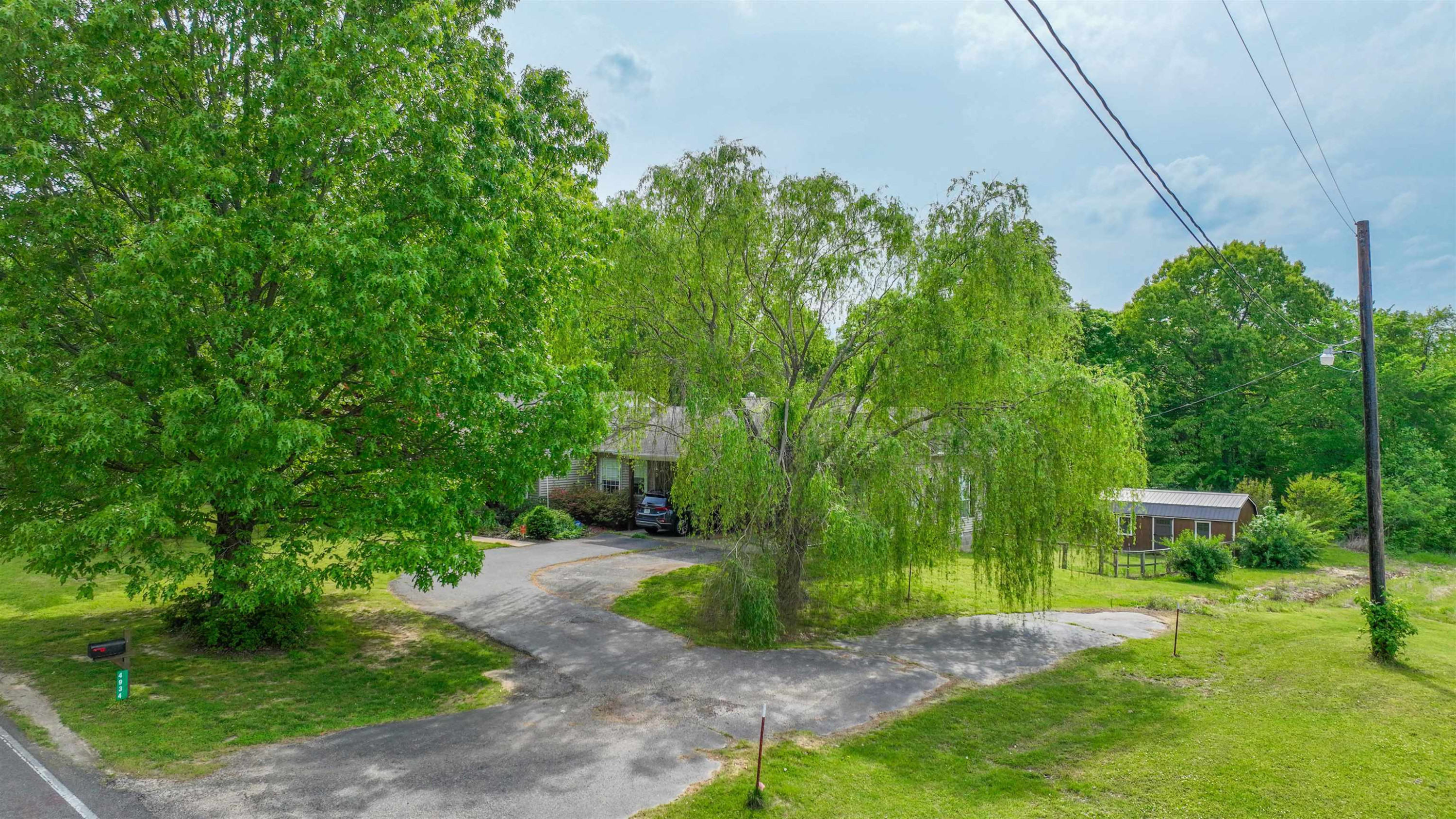 4934 Asbury Glimp Road Ripley, TN 38063 - Photo 25 of 25 a view of backyard with plants and outdoor seating