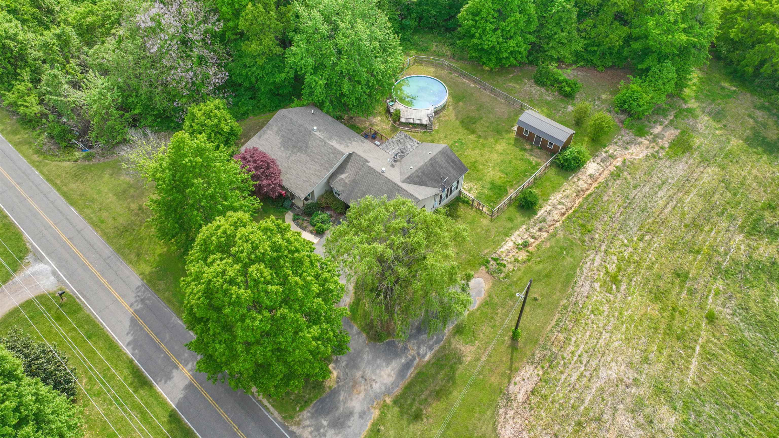 4934 Asbury Glimp Road Ripley, TN 38063 - Photo 3 of 25 an aerial view of a house with a yard basket ball court and outdoor seating