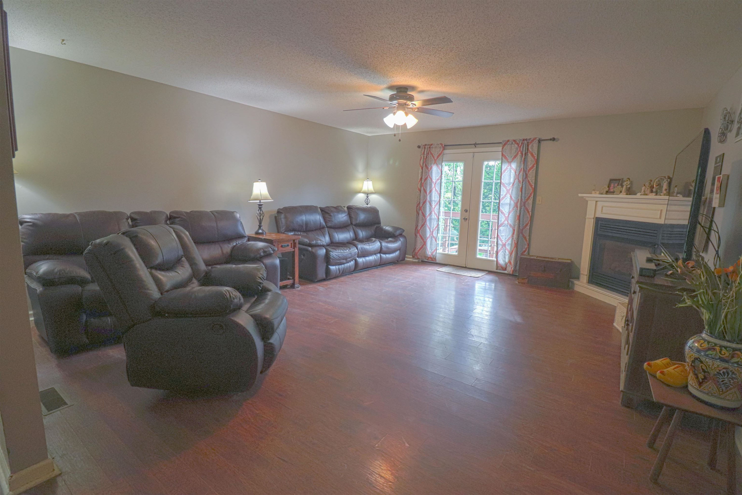 4934 Asbury Glimp Road Ripley, TN 38063 - Photo 4 of 25 a living room with furniture and a chandelier