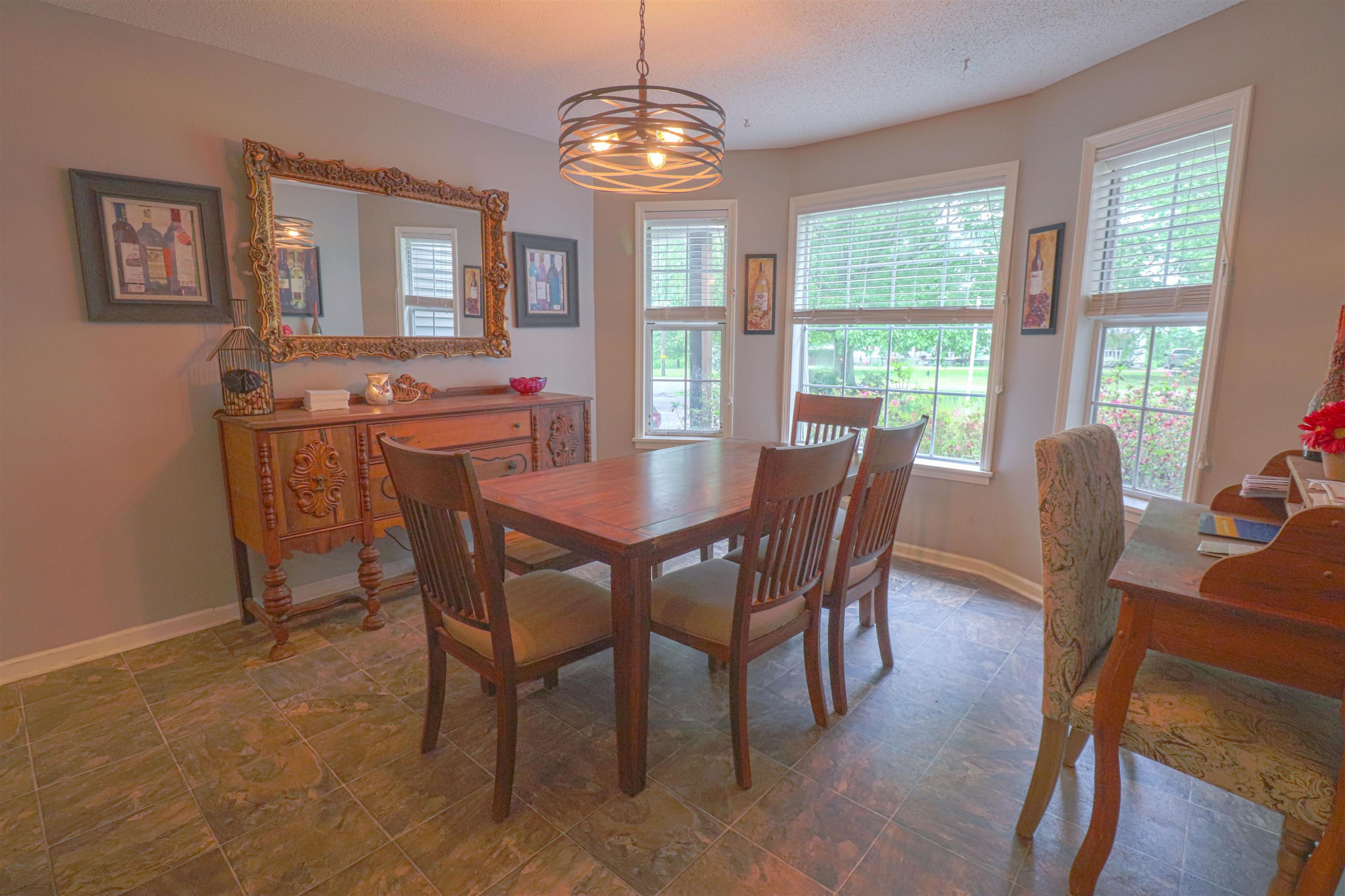 4934 Asbury Glimp Road Ripley, TN 38063 - Photo 7 of 25 a view of a dining room with furniture window and outside view