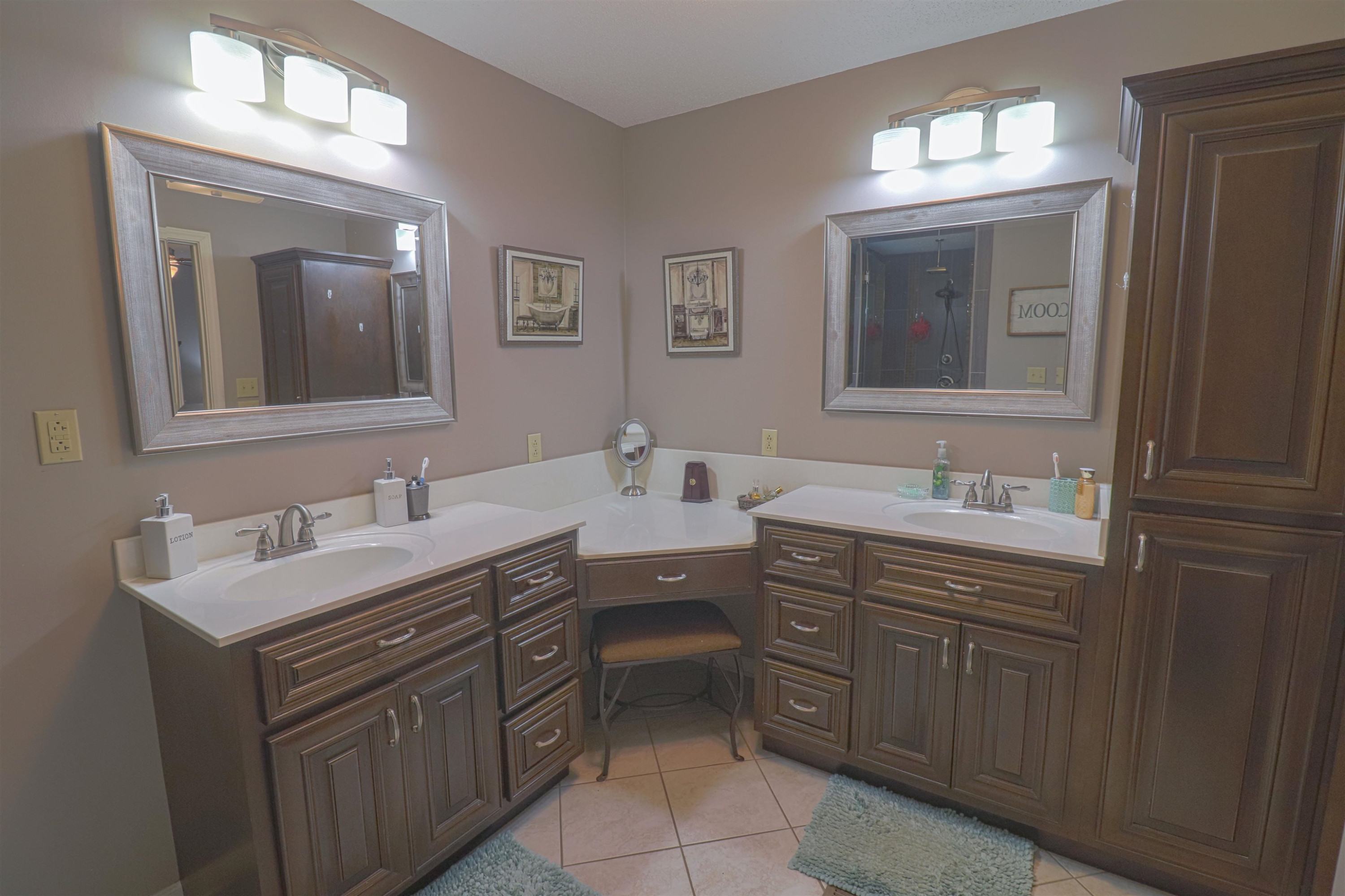 4934 Asbury Glimp Road Ripley, TN 38063 - Photo 9 of 25 a bathroom with a double vanity sink and mirror
