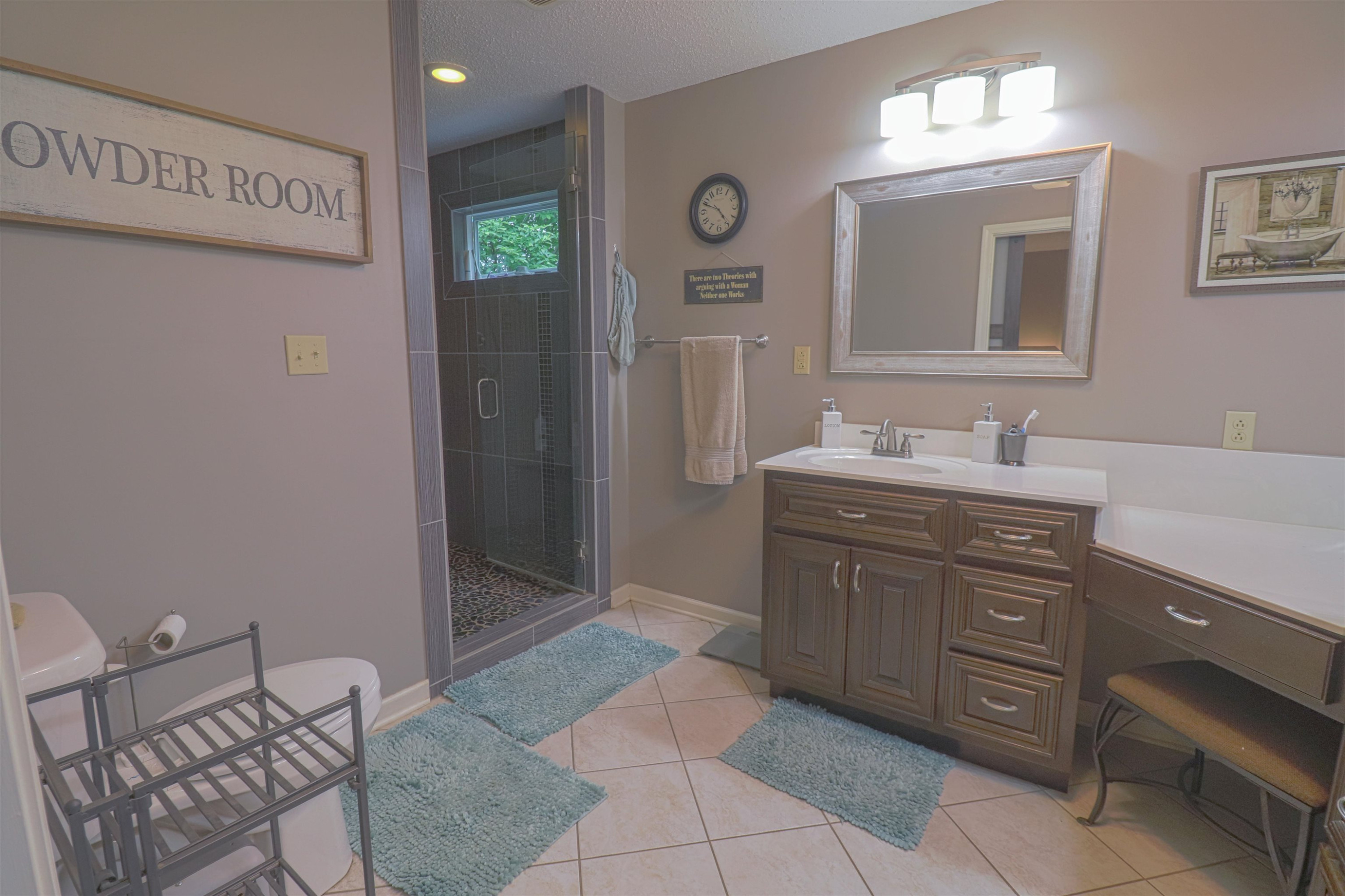 4934 Asbury Glimp Road Ripley, TN 38063 - Photo 10 of 25 a spacious bathroom with a double vanity sink and a mirror