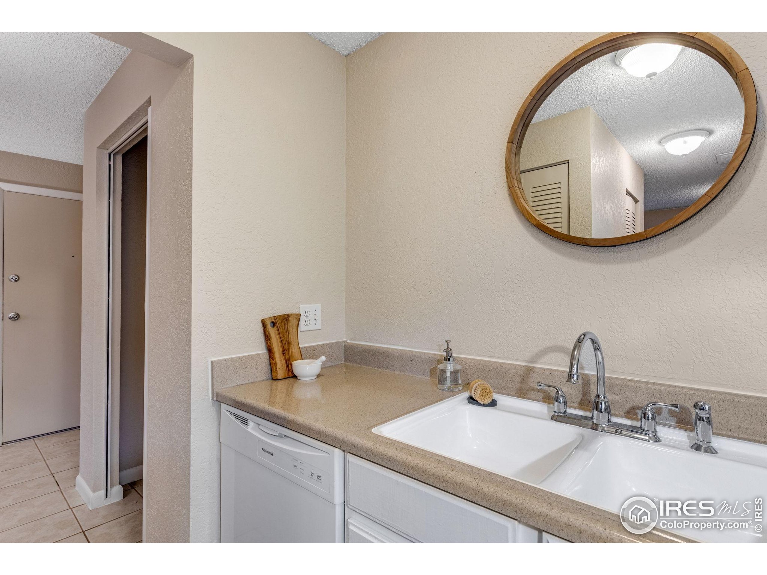 1705 Heatheridge Road Fort Collins, CO 80526 - Photo 17 of 21 a bathroom with a sink and a mirror