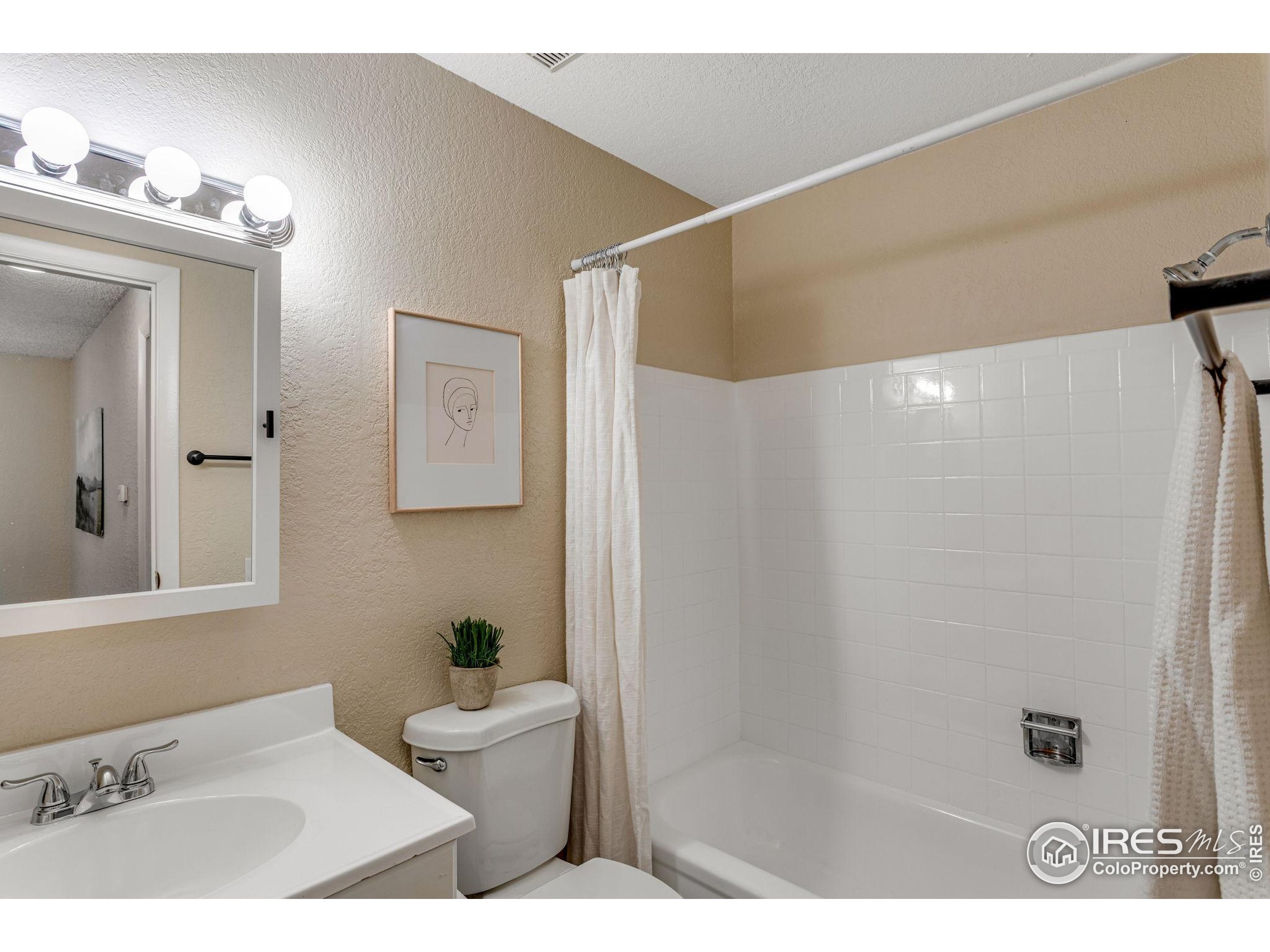 1705 Heatheridge Road Fort Collins, CO 80526 - Photo 21 of 21 a bathroom with a sink and a mirror